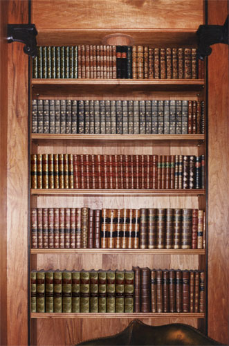 yards of leather bound books in a library on Long Island, New York
